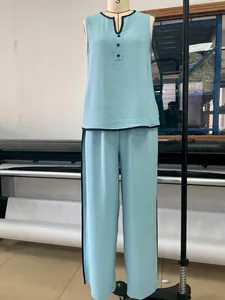 Full view of the light blue sleeveless V-neck top and wide-leg trousers set on a mannequin