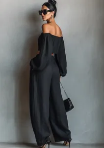 Elegant black off-shoulder crop top and wide-leg trousers set for casual chic style