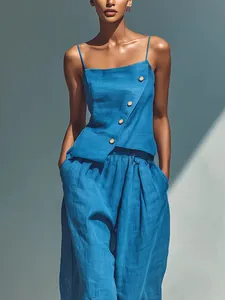 Detail of blue two-piece set featuring a buttoned camisole and wide-leg linen pants