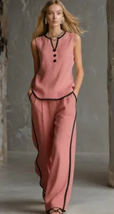 Elegant pink sleeveless set with contrast black piping and wide-leg trousers