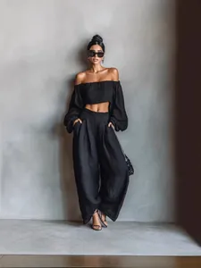 Elegant black off-the-shoulder crop top and wide-leg pants two-piece lounge set