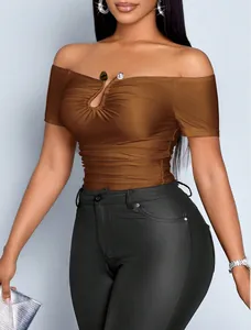 Detail view of brown off-the-shoulder slim-fit top with gathered metal buckle design