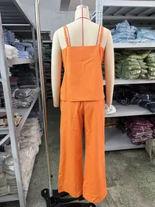 Detailed back view of orange casual camisole and wide-leg pants two-piece set on mannequin