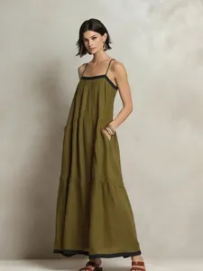 Elegant olive green tiered maxi dress with spaghetti straps and chic black contrast trim