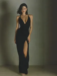 Elegant black acetate satin halter dress with high slit and slimming fit for summer.