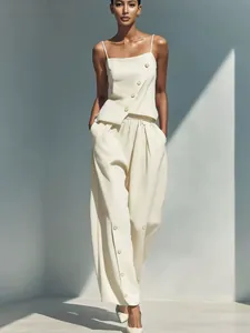 Elegant fashion two-piece set with diagonal button camisole and wide-leg pants in cream