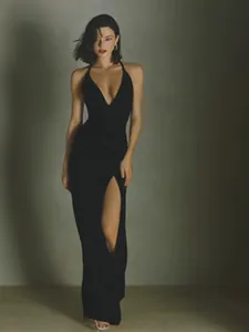 Elegant black acetate satin maxi dress with deep V-neck and high slit for summer.