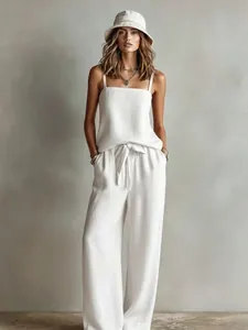Detailed studio shot of a white linen-style camisole and wide-leg trousers set
