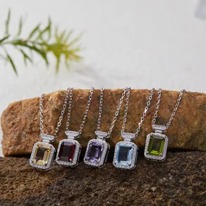 S925 silver necklaces featuring colorful square gemstones on a natural rock display