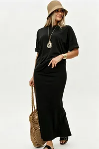 Chic black two-piece set featuring a loose short sleeve top and elegant maxi skirt