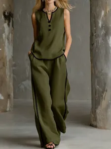 Elegant sleeveless V-neck top and wide-leg pants set with black contrast trim in olive