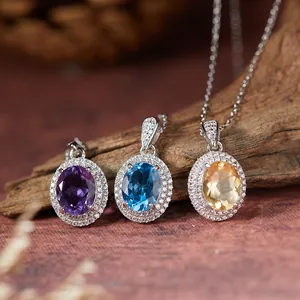 Detalle de colgantes ovales de plata S925 con amatista topacio azul y de citrino