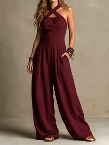 Detailed view of women's burgundy criss-cross halter neck ribbed knit wide-leg jumpsuit