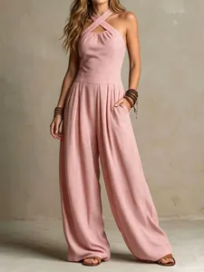 Detailed view of pink halter cross neck knitted jumpsuit with elegant wide leg cut.