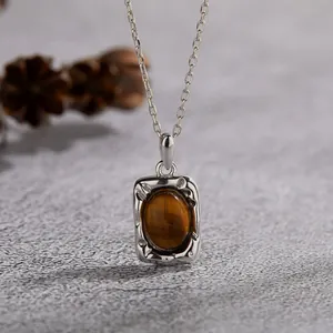 Detailed view of an S925 sterling silver necklace featuring a natural tiger's eye stone.
