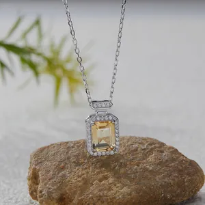 Close-up detail of a square yellow topaz gemstone pendant on a S925 silver chain necklace