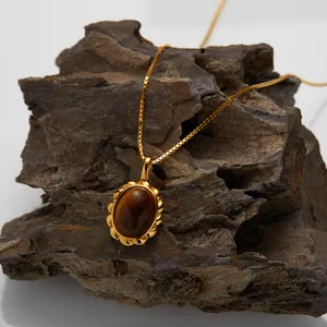 Vintage gold-plated S925 silver necklace with oval natural tiger eye stone pendant detail.
