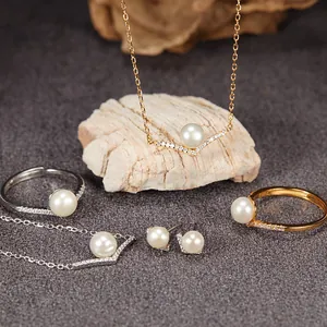 Detail view of S925 silver jewelry set featuring freshwater pearls and V-shaped design