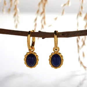 Detailed view of S925 sterling silver earrings with oval natural lapis lazuli pendants.
