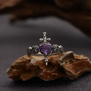 Close-up of S925 silver ring featuring a purple heart amethyst, cross, and rose details.