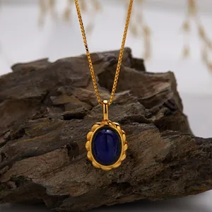 Close-up of a gold-plated sterling silver necklace with an oval lapis lazuli pendant