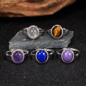 Macro view of five S925 sterling silver rings with various natural oval gemstones