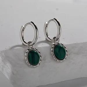 Detailed close-up of S925 sterling silver hoop earrings featuring oval malachite pendants