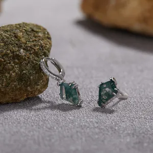 Detailed view of S925 sterling silver earrings featuring kite-shaped green moss agate stones