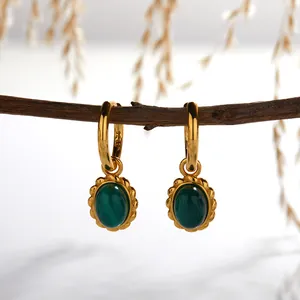 Close-up of S925 sterling silver hoop earrings with oval malachite stones