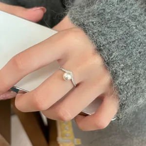 Close-up of S925 sterling silver V-shaped ring featuring a natural freshwater pearl.