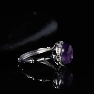 Macro view of exquisite S925 silver ring featuring purple charoite and bamboo style band