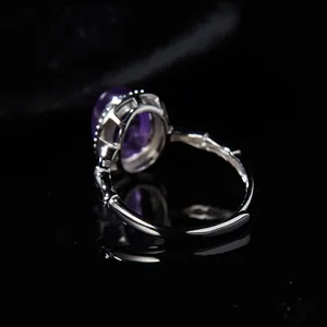 Detailed view of S925 sterling silver ring with purple gemstone and bamboo band.