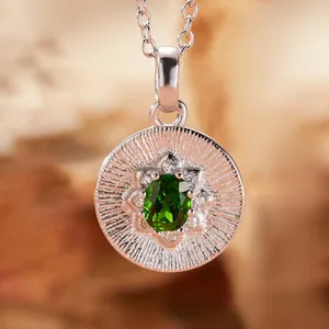 Macro close-up view of S925 sterling silver pendant featuring an oval green diopside gemstone.