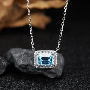Close-up of S925 silver necklace featuring a rectangular blue topaz pendant