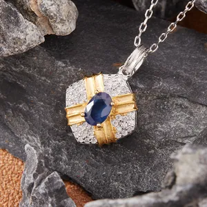 Detailed macro view of an elegant S925 silver necklace with a natural blue sapphire pendant.