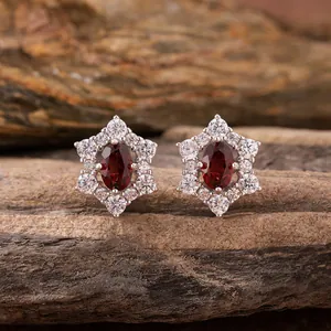 Detailed macro view of sunflower garnet earrings crafted in s925 sterling silver with white stones