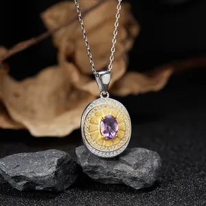 Close-up of vintage S925 sterling silver necklace with oval purple garnet pendant