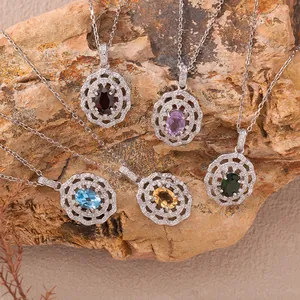 Close-up of S925 sterling silver necklaces with colorful oval-cut natural gemstones