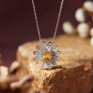 Detail of S925 silver daisy necklace with yellow oval gemstone and sparkling petals