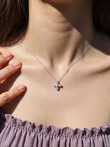 Elegant S925 silver necklace with a four-petal flower pendant and a pearl center