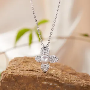 Detailed close-up of S925 sterling silver four-leaf flower necklace with pearl and stones