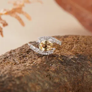 Detailed macro shot of an elegant S925 sterling silver ring set with a yellow citrine gem