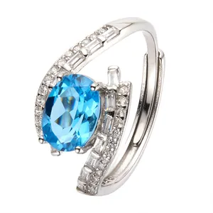 Elegant S925 sterling silver adjustable ring featuring a large oval blue gemstone and zircon