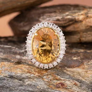 Close-up of natural oval citrine pendant with sparkling double halo in S925 silver