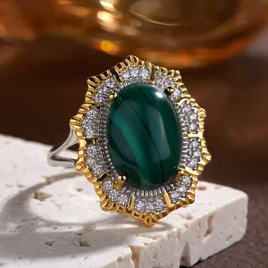 Close-up of Victorian oval green malachite ring with double-layered halo crystals
