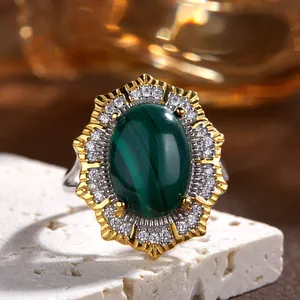 Close-up of a vintage Victorian silver ring featuring a green malachite stone with pavé