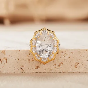 Detailed macro view of a Victorian style oval white gemstone ring with a double-layer halo