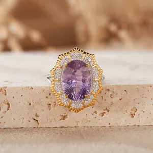 Macro view of Victorian-style oval amethyst ring with double halo micro-pave setting.