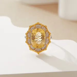 Close-up of Victorian-style oval citrine ring with double halo setting