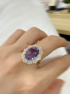 Close-up of a Victorian style amethyst ring with double-layered pavé stones on a hand